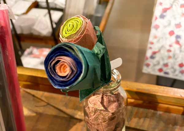 Rose flowers in a vase hand made using different types of paper
