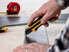 OLFA 25mm XH-AL cutting laminate flooring planks.
