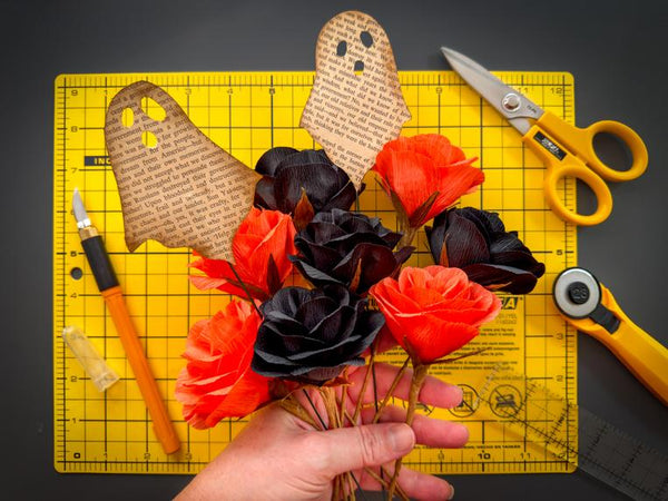 Elegant Halloween Decor: Handmade Paper Roses and Vintage Ghosts