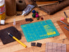 OLFA RM-6x8 6" x 8" Green Double-Sided, Self-Healing Rotary Mat, 6x8 mat, 4" ruler doing general leather crafting.