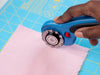 OLFA RTY-2DX/PBL Ergonomic 45 mm Rotary Cutter, Pacific Blue With Self-Retracting Rotary Blade Cutting Fabric